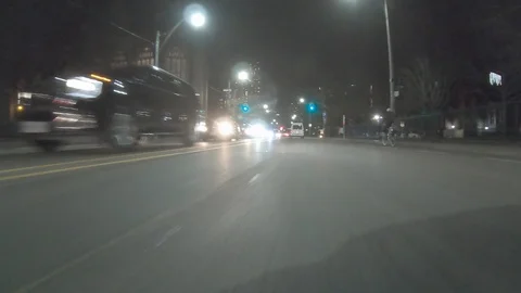 POV dark low angle drive at night on city of Toronto streets Stock Footage 99399669
