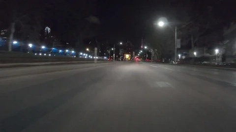 POV dark low angle drive at night on city of Toronto streets Video stock 99399785