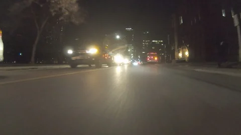 POV dark low angle drive at night on city of Toronto streets Stock Footage 99399882