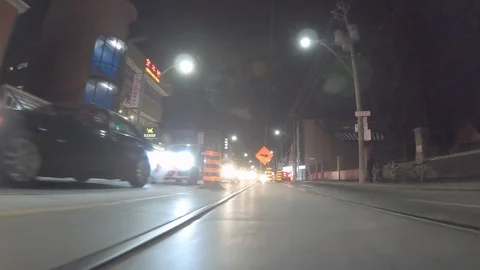 POV dark low angle drive at night on city of Toronto streets Stock Footage 99405404