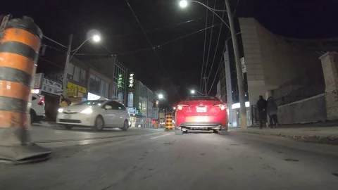 POV dark low angle drive at night on city of Toronto streets Stock Footage 99405464