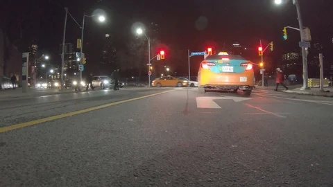POV dark low angle drive at night on city of Toronto streets Stock Footage 99406549