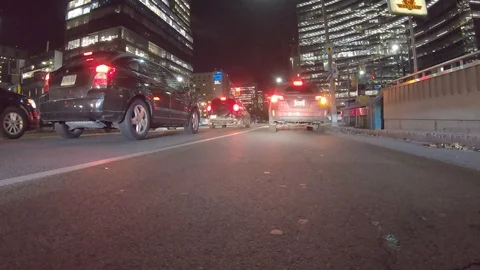 POV dark low angle drive at night on city of Toronto streets Stock Footage 99406811
