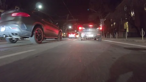 POV dark low angle drive at night on city of Toronto streets Stock Footage 99407013