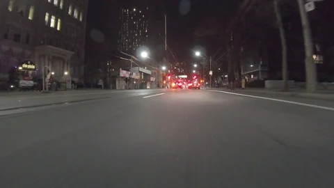 POV dark low angle drive at night on city of Toronto streets Stock Footage 99408396