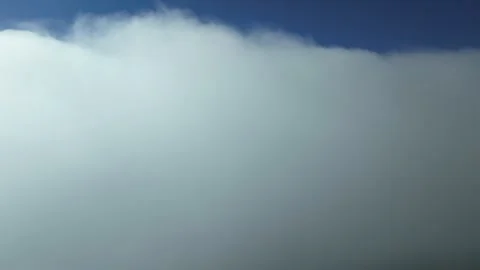 POV descending through layers of clouds, flying at supersonic speed as seen Stock Footage 301310749