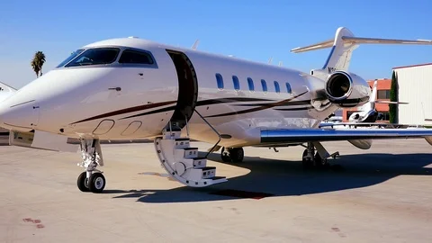 POV DOLLY INTO BUSINESS JET WITH STAIRS DOWN IN SLO-MO Stock Footage 97523839