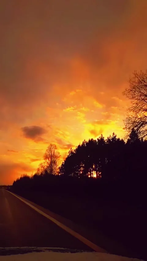 POV drive along empty road at sunset with glowing sky Stock Footage 331993006