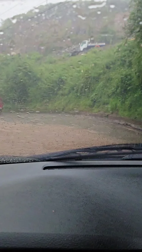 POV Drive Through Rain on Winding Mountain Roads With Moving Windshield Wipers Stock Footage 345370981