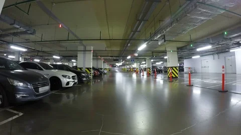 Pov drive through underground parking in city, real time. Cars enter the Parking Stock Footage 80814636