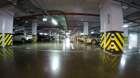 Pov drive through underground parking in city, real time. Underground Parking Stock Footage 81046266