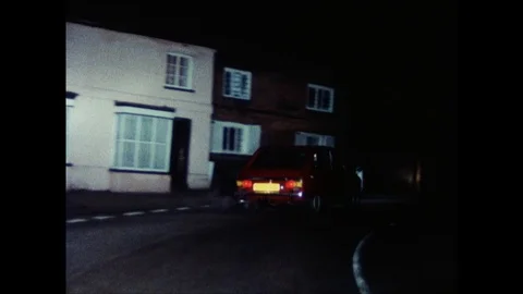 POV driver driving behind another car, united kingdom, 1979 Stock Footage 131531998