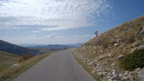 POV from the drivers perspective through a winding mountain road Stock Footage 98500755