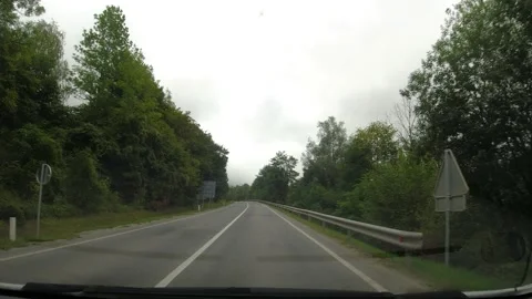POV of driving a car on an empty countryside road Slovenia Stock Footage 229474581