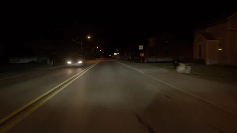 Pov Driving Car In Small Town at Night Stock Footage