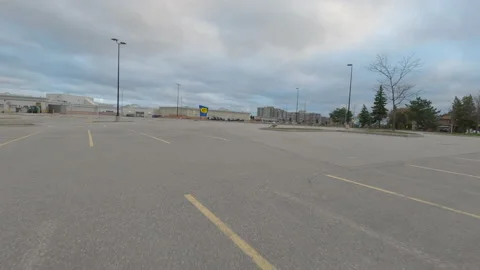 POV driving city streets empty and shopping mall in COVID 19 pandemic lockdown Vídeo Stock 153064458