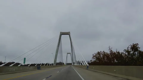 POV driving cross a large cable stayed bridge. Tall support towers and steel Stock-Footage 321448645