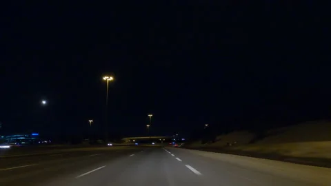 POV driving on dark empty city streets during COVID 19 pandemic lockdown Stockbeeldmateriaal 147878450