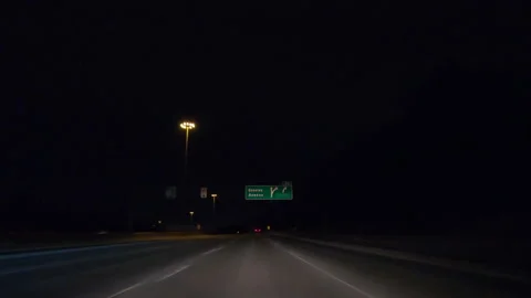 POV driving on dark empty city streets during COVID 19 pandemic lockdown Видео 147881365