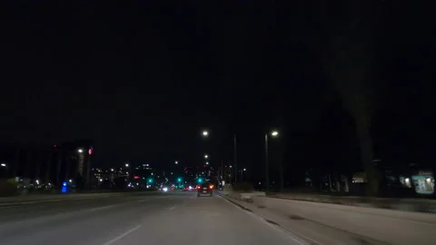 POV driving on dark empty city streets during COVID 19 pandemic lockdown Vídeo Stock 147902262