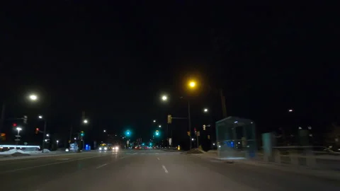 POV driving on dark empty city streets during COVID virus pandemic lock down Stockbeeldmateriaal 147904894