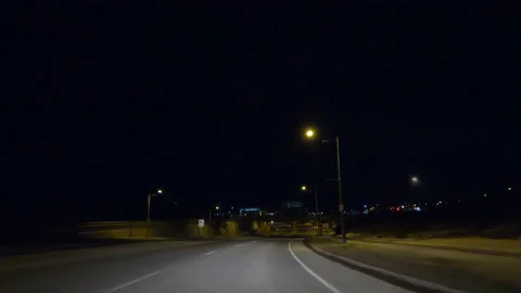 POV driving on dark empty city streets during COVID virus pandemic lock down Vídeo Stock 147924036