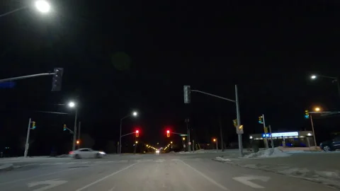 POV driving on dark empty city streets during COVID virus pandemic lock down Stockbeeldmateriaal 147929309
