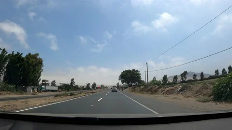 Pov driving down the road next to some cyclists in the day in point of view in 4 Stock Footage 197082815
