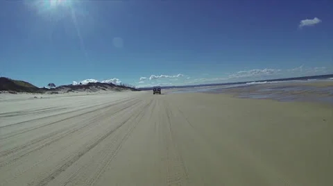POV of a driving down a wide open beach Stock Footage