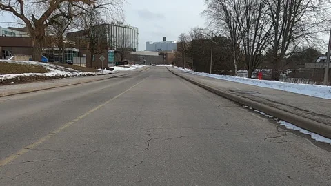 POV driving in empty college and university town in COVID 19 pandemic Stock Footage 147374073