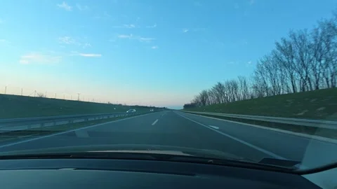 POV Driving on Empty Highway at Twilight – Blue Sky, Timelapse Ready Stock Footage 331063823
