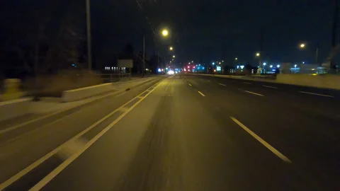 POV driving fast reverse shot at night in the dark with car traffic Stock Footage 146923703