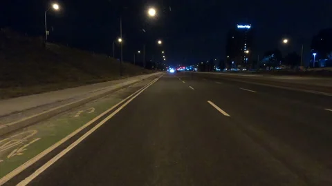 POV driving fast reverse shot at night in the dark with car traffic Video stock 146923963