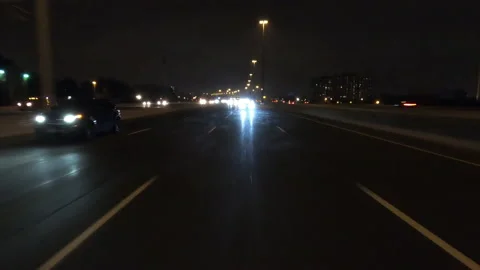 POV driving fast reverse shot at night in the dark with car traffic Vídeo Stock 146929603