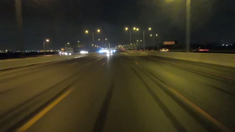POV driving fast reverse shot at night on dark highway with car traffic Stockbeeldmateriaal 146931715