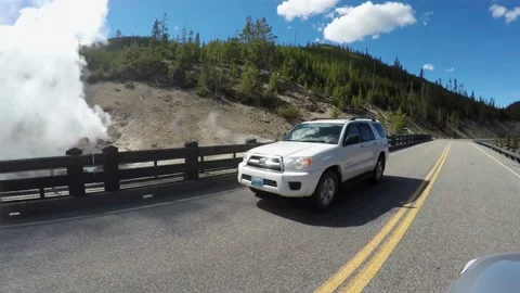 POV Driving at the  Grand Loop Road  with the Beryl Spring view. Yellowstone NP Stock Footage 151843205
