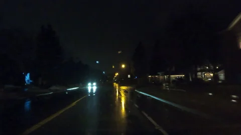 POV driving in heavy rain on dark wet city streets in poor visibility at night. Stock Footage 146698569