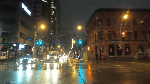 POV driving in heavy rain on dark wet city streets in poor visibility at night. Stockbeeldmateriaal 146736618