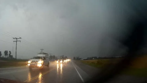 POV driving in heavy rain into severe tornado producing thunderstorm Stock Footage 78691053