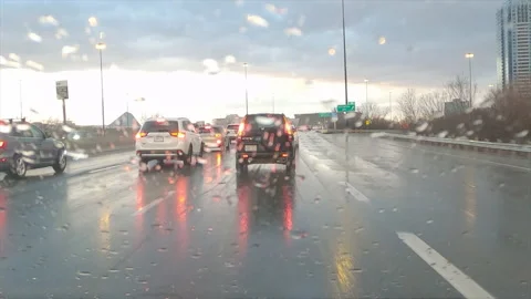 POV driving in heavy rush hour highway traffic in the rain Stock Footage 150397664