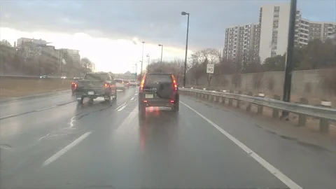 POV driving in heavy rush hour highway traffic in the rain Видео 150399098