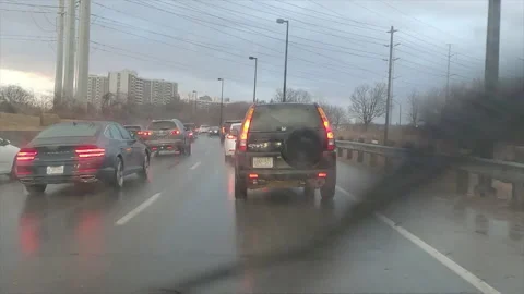 POV driving in heavy rush hour highway traffic in the rain Видео 150400262
