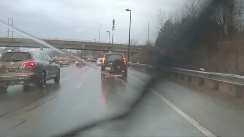 POV driving in heavy rush hour highway traffic in the rain Stock Footage 150400721