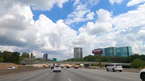 POV driving on Interstate 285 east with view of skyscrapers and buildings Stock-Footage 143228530