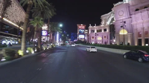 POV Driving Las Vegas Boulevard Past Caesars Palace Casino- Night Stock Footage