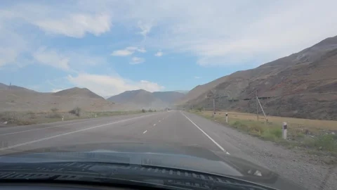 POV driving on a mountain highway, Issyk-Kul Region, Kyrgyzstan Видео 347242549