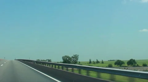 POV driving over a bridge through the Midwest plains Video stock 40544331