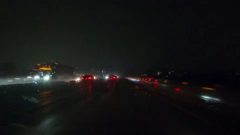 POV driving on a pitch back dark wet rainy night in the city streets Видео 156744760