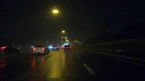 POV driving on a pitch back dark wet rainy night in the city streets Video stock 156766084