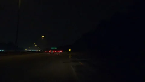 POV driving on a pitch back dark wet rainy night in the city streets Vídeo Stock 156768417
